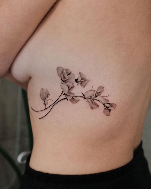 Side Body Art of Sweet Pea Flower tattoo