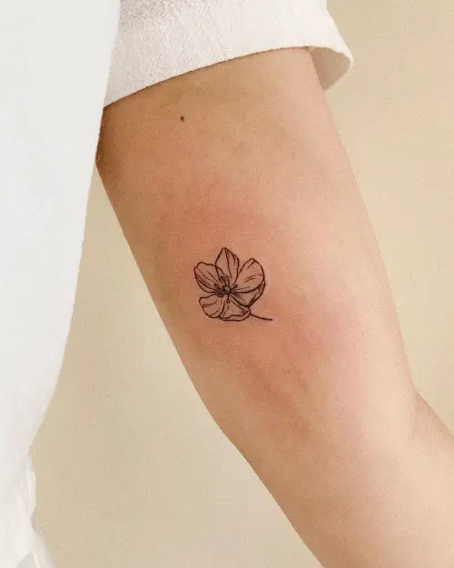small Flower on Bicep tattoo