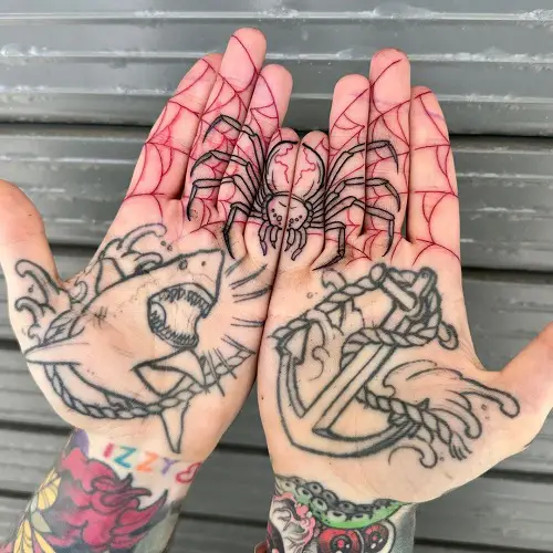 Red Web with Black Spider on Fingers