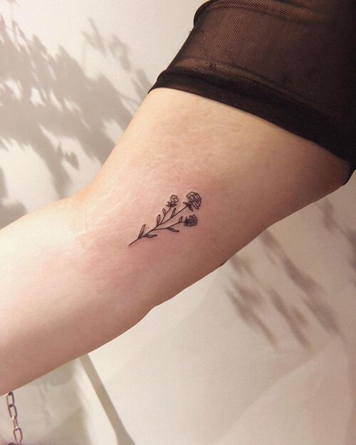 Tiny Carnation Birth Flower Ink on Bicep Tattoo 13