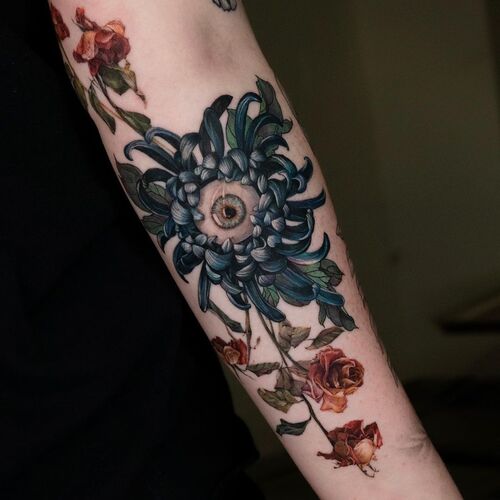 Blue Chrysanthemum Tattoo with an Eye in the Middle