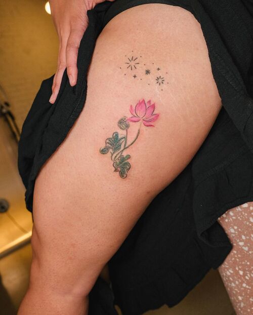 Small Lotus Flower and Stars Thigh Tattoo