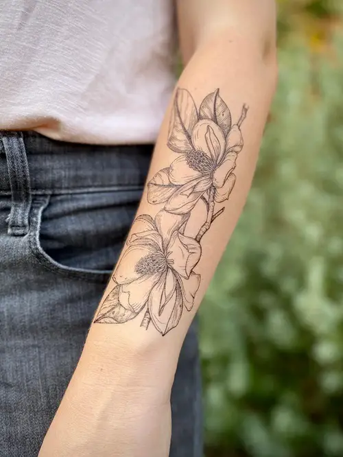 Magnolia Pair on Forearm tattoo