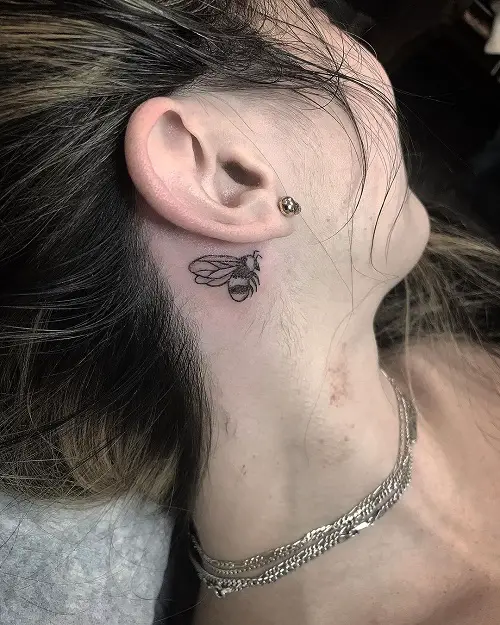 Small Bumble Bee Behind the Ear tattoo