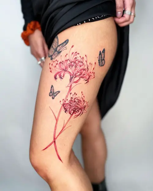 Feminine Spider Lily Thigh Design with Butterflies Tattoo