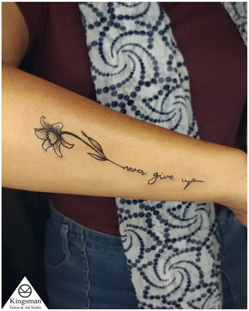 Narcissus Flower Tattoo with “Never Give Up”