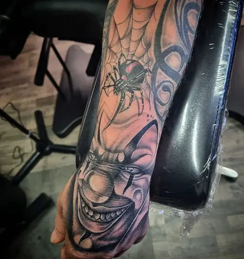 Black Widow Spider Tattoo with Clown Face
