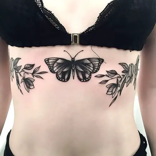 Butterfly on Sternum with Floral Branches on Each Side tattoo
