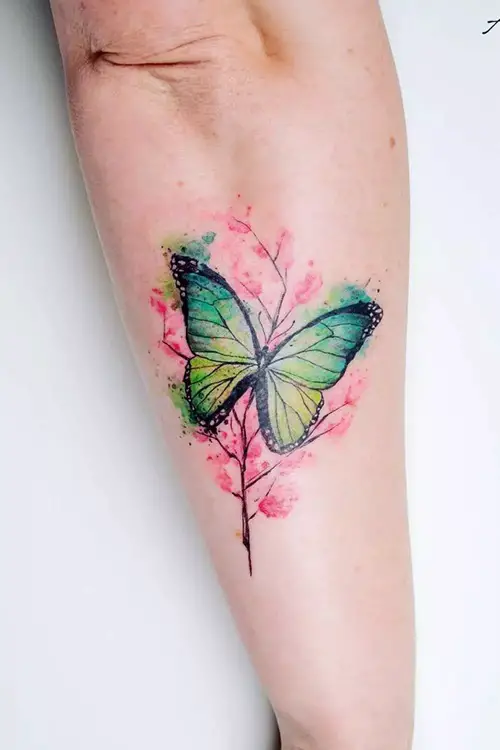 Green Butterfly with Pink Floral Tree tattoo