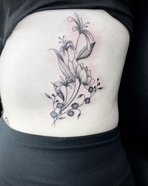 Side Body Ink with Honeysuckle and Larkspur tattoo