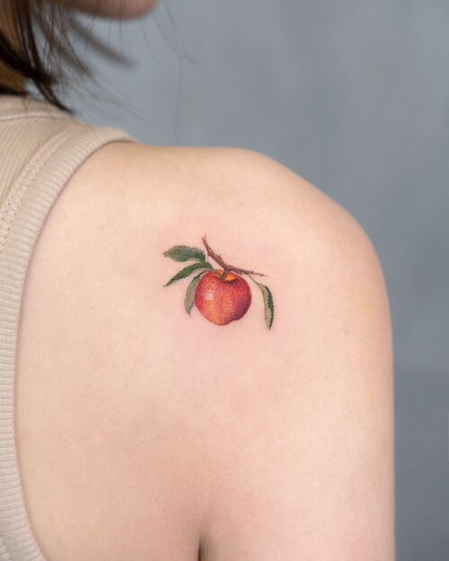 Tiny Apple on the Shoulder apple tattoo ideas