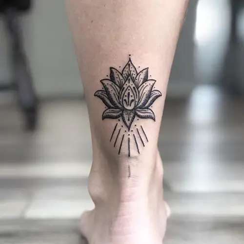 Black Lotus Tattoo on Ankle meaning and ideas