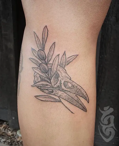 red skull and olive branch tattoo